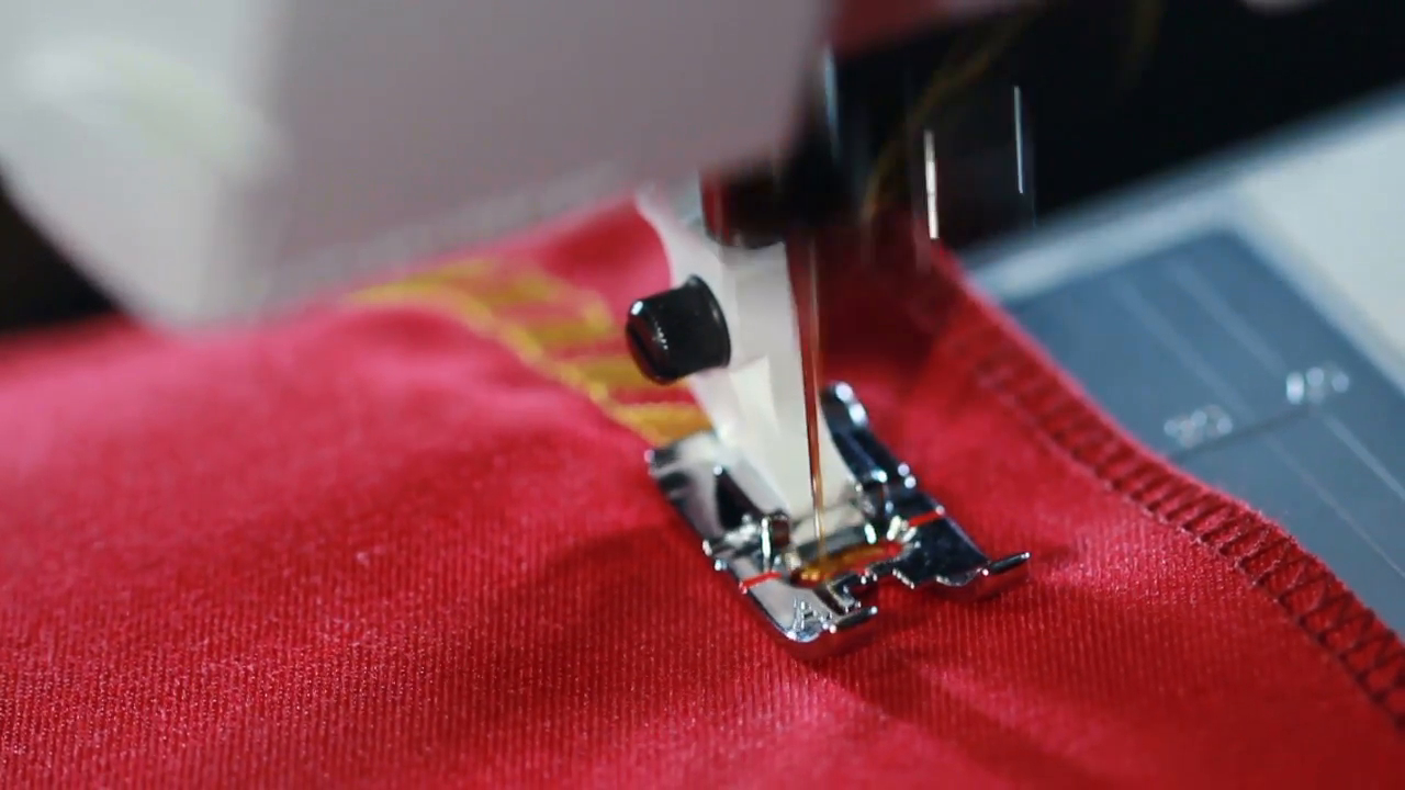 Embroidery Patterns For Sewing Machines Embroidery Machine Sewing Machine Embroider Pattern On The Fabric Sewing Needle Stitching Seam On Fabric In Slow Motion Yellow Thread Pattern On Red Fabric Sewing Machine Slow Motion
